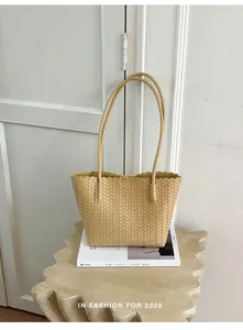 Elegant beige hand-woven faux leather tote bag with long shoulder straps for women