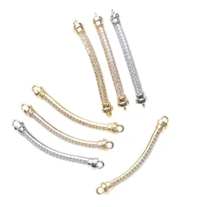 Close-up of curved 18K gold plated connector tubes with sparkling CZ stones for DIY jewelry