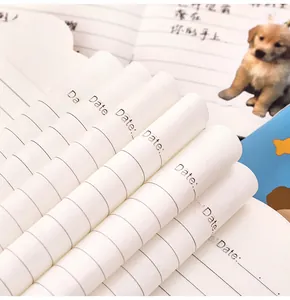 Close-up of inner lined pages of a cute dog shaped mini notebook with date section