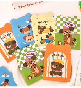 Detailed view of various cute cartoon puppy-shaped mini notebooks in colorful designs