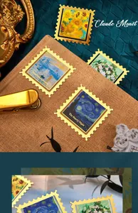 Detail of vintage metal stamp-shaped bookmarks featuring famous oil painting designs