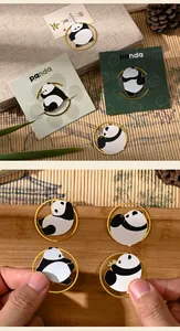 Detailed view of cute panda metal bookmarks with gold-finish rings and enamel finish