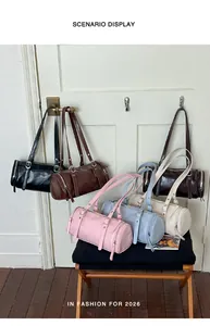 Scenario display of various colorful vintage cylinder pillow shoulder bags for women