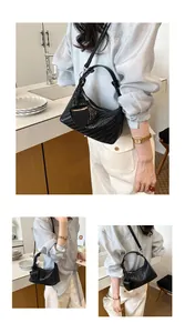 Detail views of a chic black woven shoulder bag with an attached mini heart pouch.