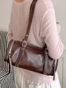 Vintage dark brown cylindrical pillow shoulder bag with glossy textured PU leather finish
