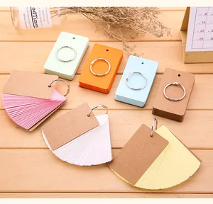 Close-up of colorful loose-leaf flashcards with metal rings for student note-taking.