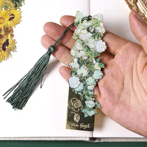 Vintage gold metal bookmark featuring Van Gogh roses and a green tassel for books