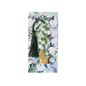 Vintage gold plated metal bookmark with white flowers and dark green tassel