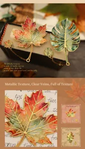 Detailed macro view of metal leaf bookmarks with intricate maple and monstera leaf patterns
