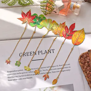 Detailed metal leaf bookmarks in various autumn colors and shapes with gold chains.