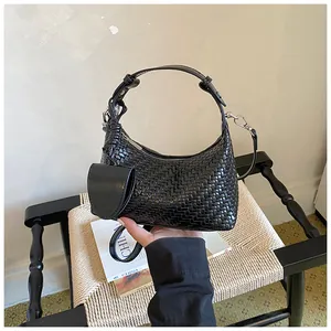 Premium women's black woven hobo handbag with a matching round coin pouch accessory