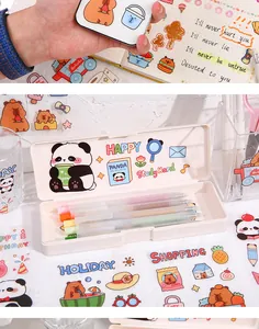 Close-up of cute panda and capybara PET stickers applied to a white stationery pencil box