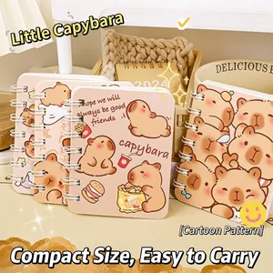 Detailed macro shot of cute Capybara cartoon A7 spiral notebooks with metallic coils