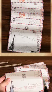 Λεπτομέρεια vintage φακέλων airmail με εκτυπώσεις Πύργου Άιφελ και Άγαλμα Ελευθερίας