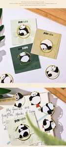 Detailed macro view of cute metal panda bookmarks on artistic card packaging