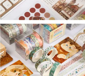 Close-up detail of cute cat washi tapes and floral stickers for DIY scrapbooking and journaling