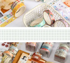 Decorative washi tape rolls and cute stickers for DIY scrapbooking and journal art