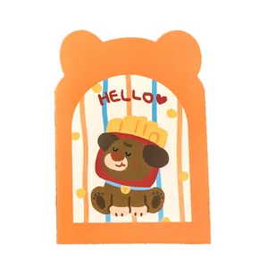 Cute orange bear-shaped mini notebook featuring a cartoon dog and HELLO text design