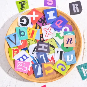 Colorful alphabet stickers for DIY craft and journal decoration in a wooden bowl.