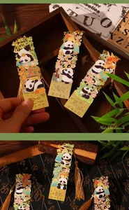 Detailed view of ornate gold panda metal bookmarks with colorful enamel and silk tassels