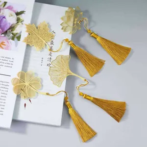 Segnalibri in metallo dorato a forma di foglia con nappe e disegni di ginkgo