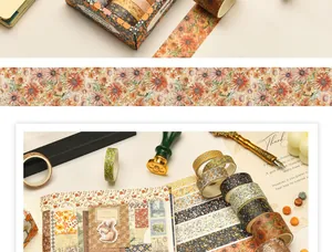 Close-up detail of vintage floral washi tapes and squirrel stickers for journaling