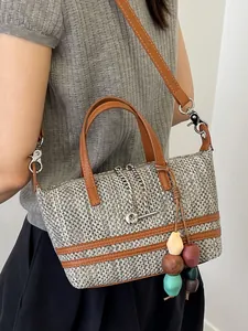 Stylish handmade woven tote bag with leather straps and colorful bead tassels charms