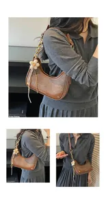Close-up shots of a stylish brown hobo bag featuring a floral charm and elegant gold chain strap
