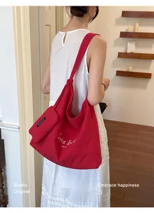 Red large capacity canvas tote bag for women, perfect for daily commute and casual style.