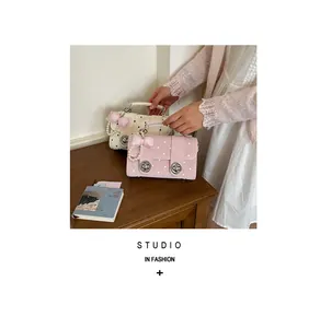 Polka dot handbag with cute bow ornament detail