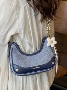 Stylish color-block crescent crossbody bag with chain strap and flower charm