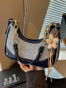 Elegant navy contrast shoulder bag for women with gold chain and flower charm