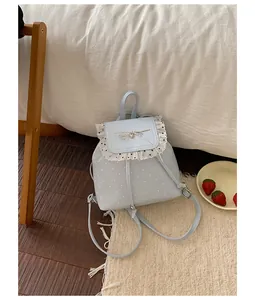 Sweet light blue polka dot mini backpack with lace trim and bow decoration