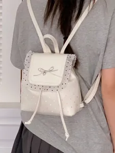 Sweet white mini backpack featuring red polka dots and delicate lace trim for stylish girls