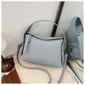Light blue pebble grain leather square crossbody bag with top handle for women
