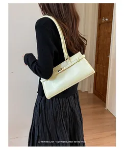 Minimalist cream yellow rectangular underarm tote bag with stylish metal twist lock