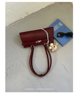 Sophisticated retro burgundy tote bag on grey background with minimalist aesthetic style