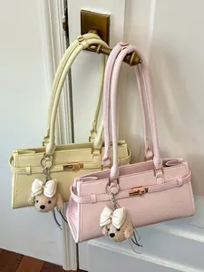 Two stylish Korean style underarm tote bags in pastel yellow and pink with cute charms
