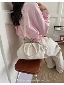 Elegant white pleated crossbody shell bag with kiss-lock closure in vintage style