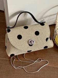 Chique mini crossbody tas met stippen patroon, zilveren ketting en stevig handvat