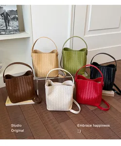 A variety of stylish woven bucket bags in six colors shown in a lifestyle setting.