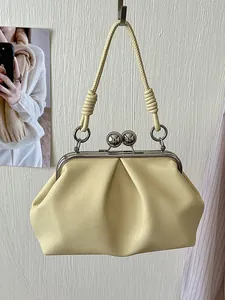 Elegant pale yellow pleated handbag for women featuring a metal kiss-lock and top handle
