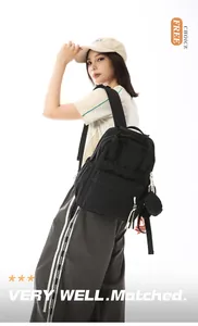 Detail side view of a black lightweight backpack for women commuting and daily travel