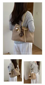 Modern high-capacity commuter tote bag with charming accessories for women