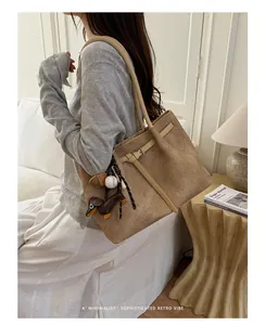Sophisticated khaki commuter tote bag featuring textured fabric and long leather straps