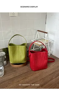 Chic woven bucket bag scenario display in vibrant green and red faux leather for women