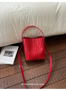 High-quality red woven leather bucket bag for women with adjustable strap detail