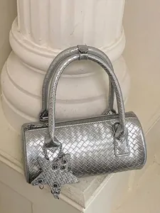 Elegant metallic silver woven mini barrel bag featuring a star charm and top handles