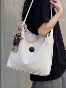 Minimalist off-white nylon drawstring tote bag with MS logo and cute rabbit charm