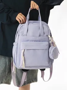 Stylish lilac nylon backpack for women with matching coin purse charm and tassels